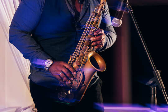 Saxophonist performing at a live music event