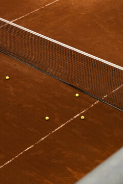 Tennis court with balls and lines.