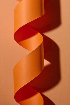 Beautiful orange ribbon on orange background