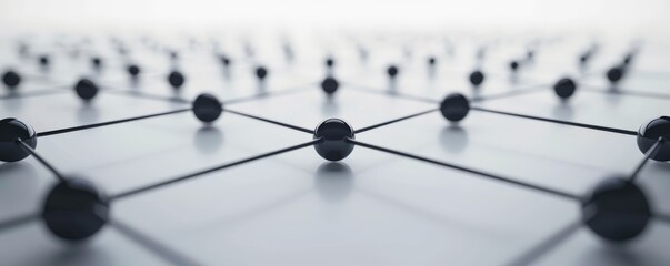 Abstract image of a lattice structure with black spheres connected by white lines on a white background.