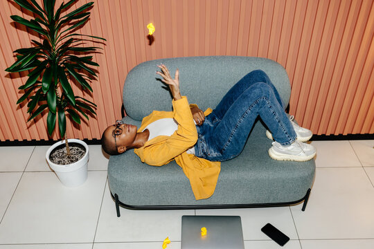 Woman tossing crumpled paper