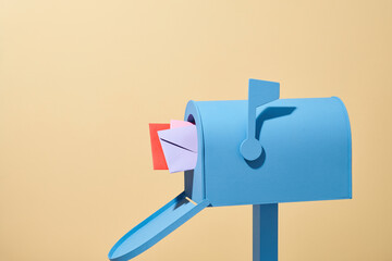 Incoming mail. mailbox with letter isolated on beige background