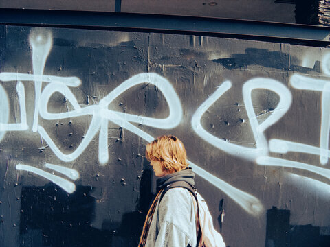 Girl against a background of graffiti