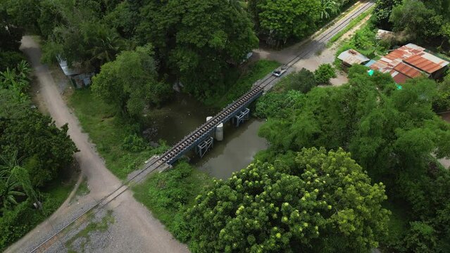 Tourists Roll Across Bridge On The Bamboo Railway In Rural Battambang Cambodia