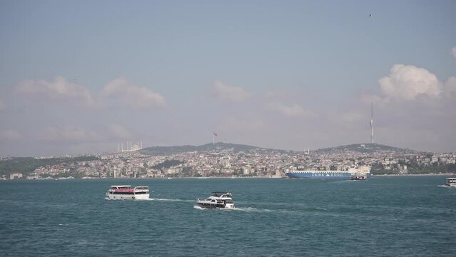 Ships, ferries, boats, historical buildings in the Bosphorus, Istanbul, Turkiye