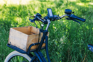 Close-up of city electric bike over green lawn, sustainable transport