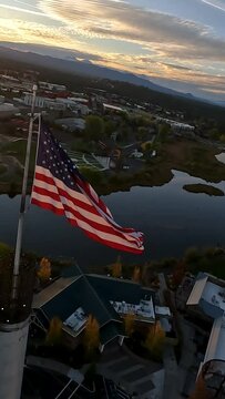 Vertical cinematic aerial slow motion of flag