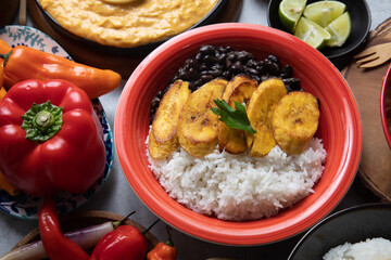 Black beans and white rice with fried plantains banana cuban venezuelan food