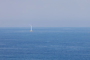 Wind power turbine in the middle of the sea, sustainable energy