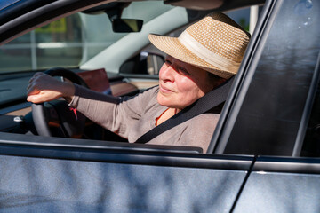 Confident woman in her new car