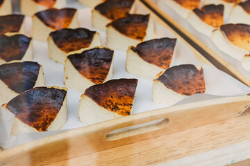 Slices of basque cheese cakes at the window display at local bakery, Bilbao, Spain