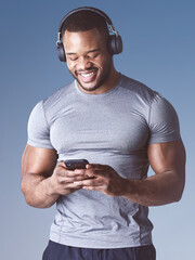 Black man, music and phone for fitness in studio, exercise and audio for workout motivation. Male...