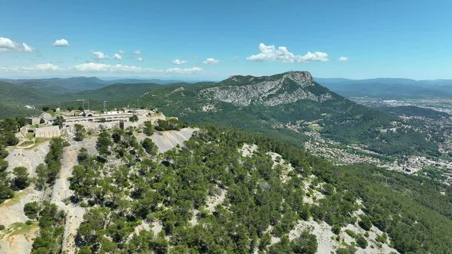 Fort de la croix faron on a sunny day with expansive mountain and valley scenery, aerial view