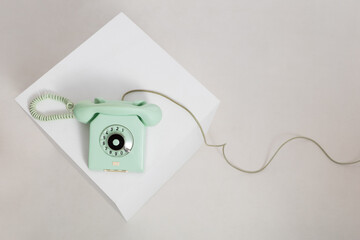 Top view at vintage mint colored rotary telephone