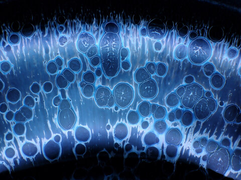 Textured background of microscopic glaze of Chinese ceramics tea cup