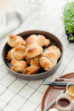 Easter buns in the form of birds on the table