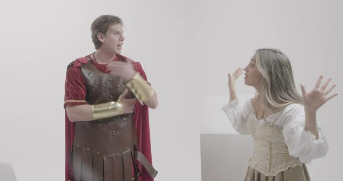 Men and Women Wear Unique Roman Soldier Costumes at Indoor Studio for Stock Content Production