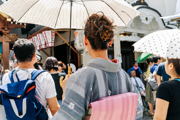 Young woman wearing a yukata, a traditional costume for festivals