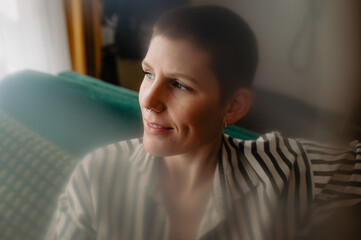 calm peaceful content woman looking to the side with a slight smile