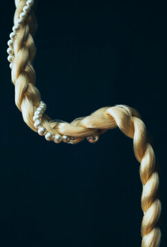 Pearls and hair braid.