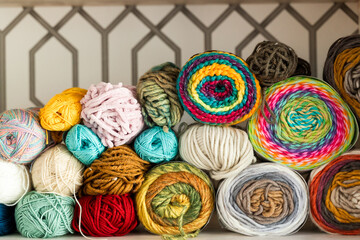 Colorful assortment of yarn balls on shelves