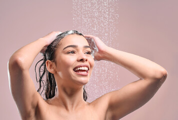 Woman, hair and shower or wash in studio, pink background and relaxing for cleaning or model with...