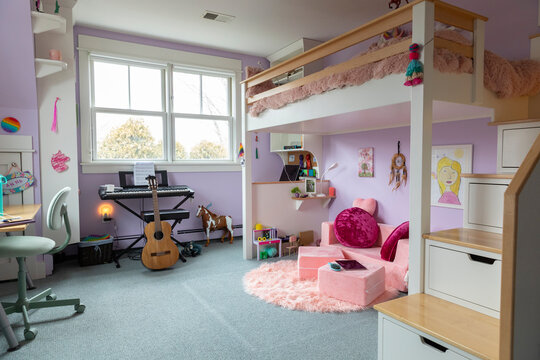 Girl Child's bedroom interior decor in home with bunk bed and guitar  