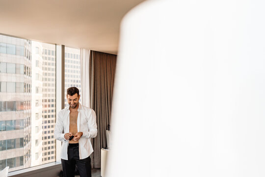 Man with shirt unbuttoned 