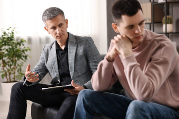 Professional psychotherapist working with patient in office