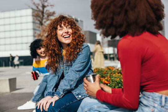 Cheerful friends enjoying a sunny day outdoors