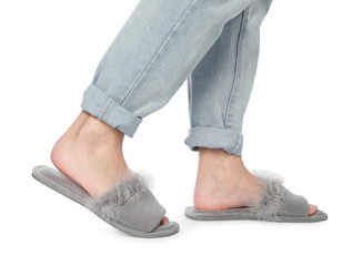 Woman in grey soft slippers on white background, closeup