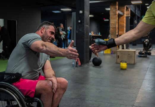Wheelchair Athlete Fist Bumping Coach