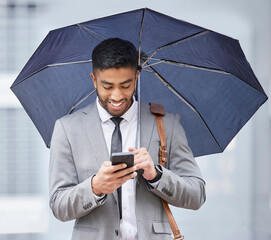 Business, smartphone and man in city, rain and texting with contact, message and travel with...