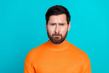 Photo of irritated annoyed young man wear orange stylish clothes isolated on cyan color background