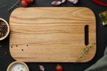 Cutting board, fresh tomatoes and different spices on grey textured table, flat lay