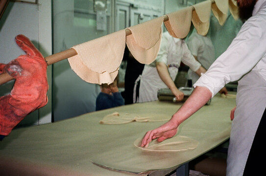 Artisanal Preparation Of Matzo For Passover.
