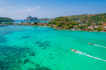Fototapeta premium longtail boat turquoise clear water in Phi Phi, Krabi Thailand. Amazing travel landscape photo in Thai