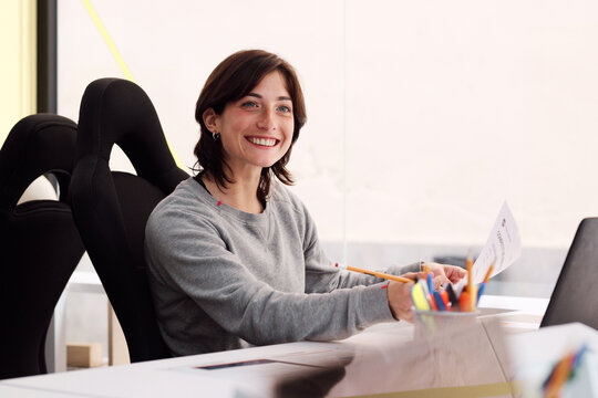 Smiling student at desk