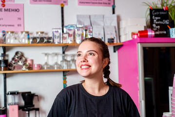 Coffee shop owner businesswoman standing behind the counter