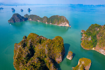 Aerial view of limestone island in Phang nga bay with mangrove jungle Thailand. Concept tropical...