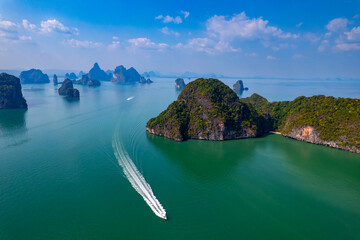 Aerial view Tourist speed boat in national park Phang Nga bay and Hong island with jungle, trip in Thailand. Concept nature beautiful landscape of Asia travel