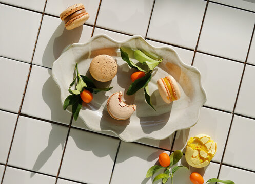 French macaron dessert on white tile background