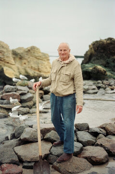portrait of an elderly man by the sea