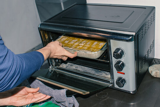 Placing Food in Oven for Baking