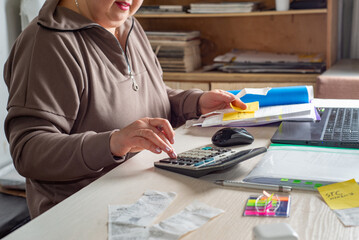 Accountant counts on a calculator