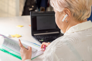 Businessman working in office with documents and office equipment