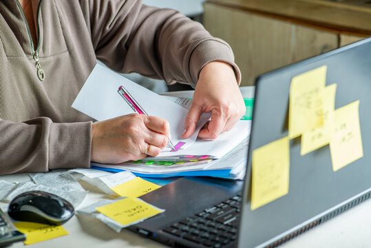 Anonymous hands of an accountant working with documents