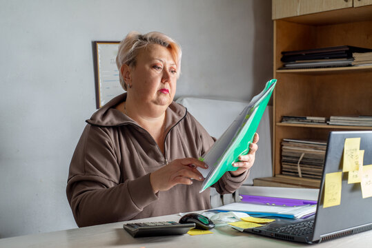 Female accountant working with documents in the office