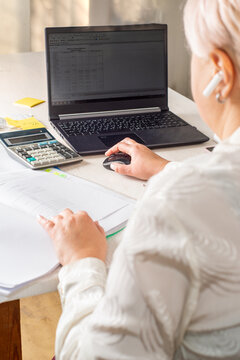Businessman working in office with documents and office equipment