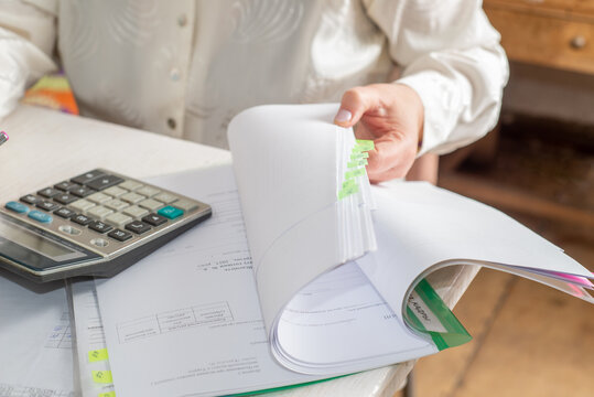 Accountant counts on a calculator